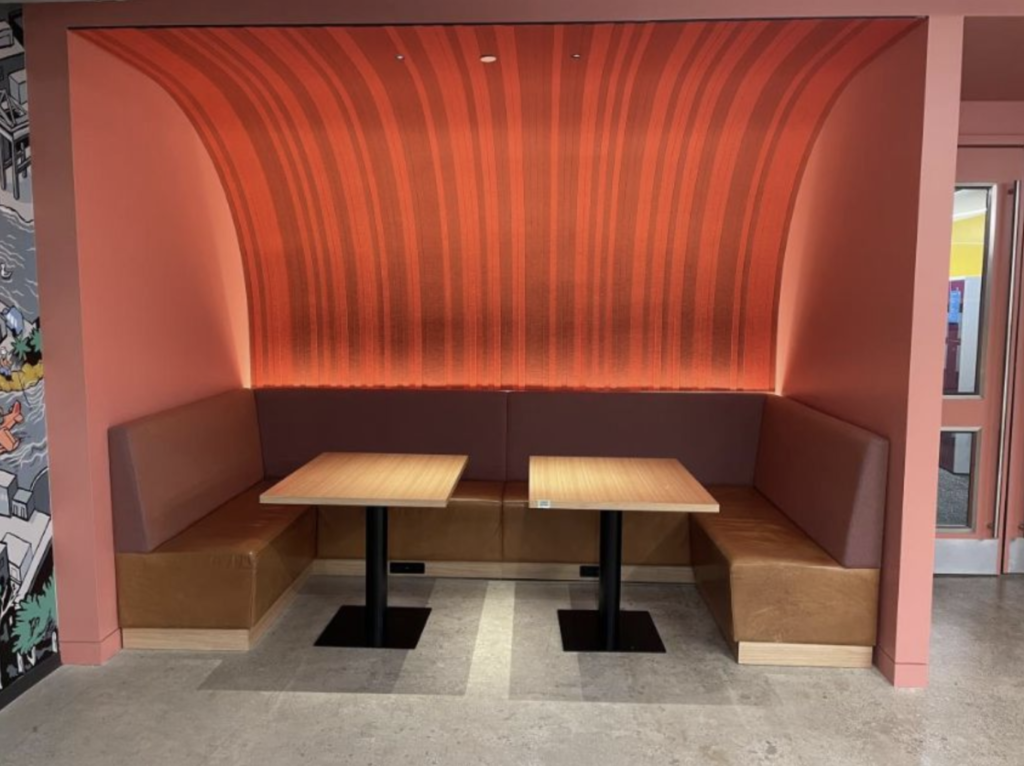 Restaurant-style dining area tables and chairs for Twitter employees.