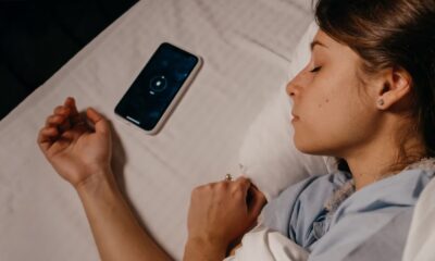 Woman asleep with smartphone